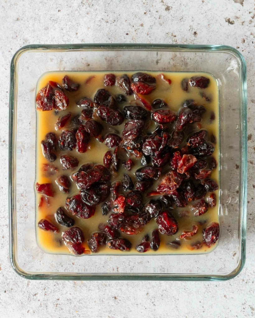 Dried cranberries soaking in orange juice