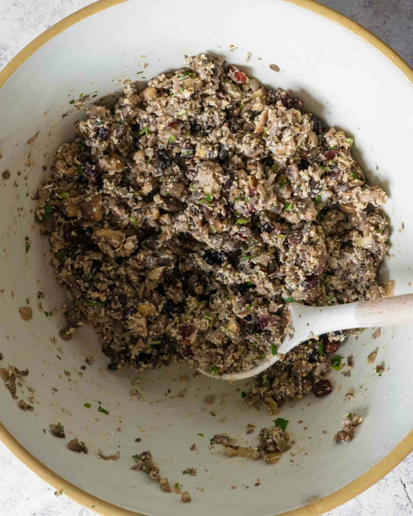 Vegan chestnut stuffing mixed up in a bowl, ready to cook