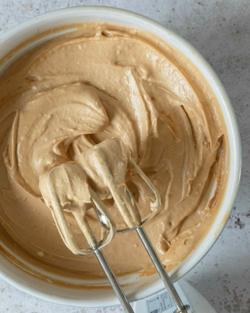 Biscoff cheesecake filling being whipped in a bowl