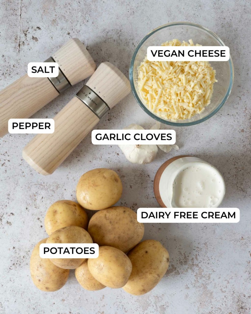 Ingredients for making vegan potatoes dauphinoise laid out on a table