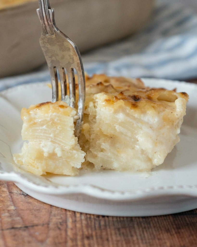Potatoes au gratin sat on a white plate