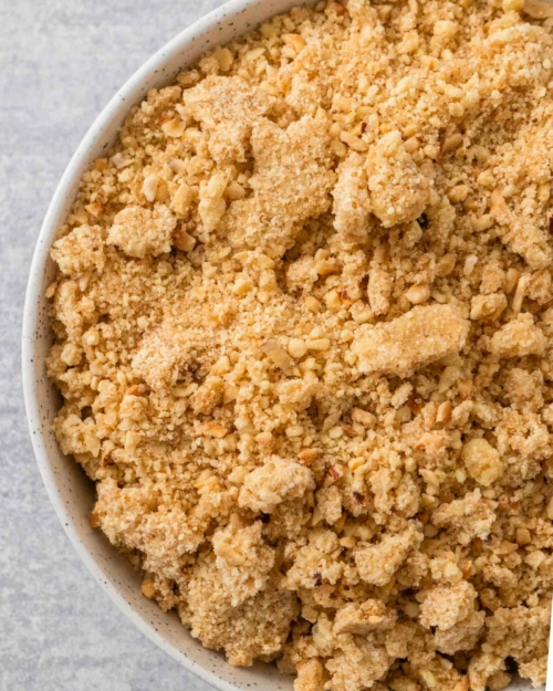Freshly cooked hazelnut crumble topping in a bowl