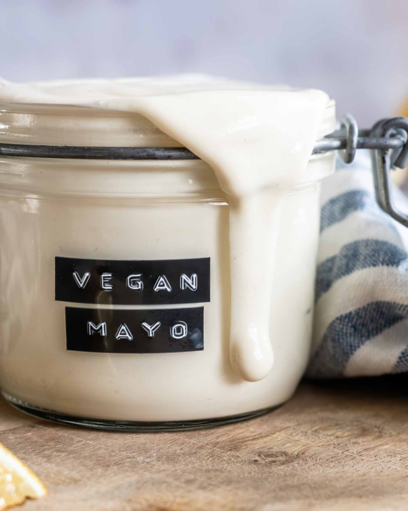 A glass jar of vegan mayo