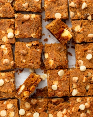 Square of vegan pumpkin chickpea blondies with white chocolate chips