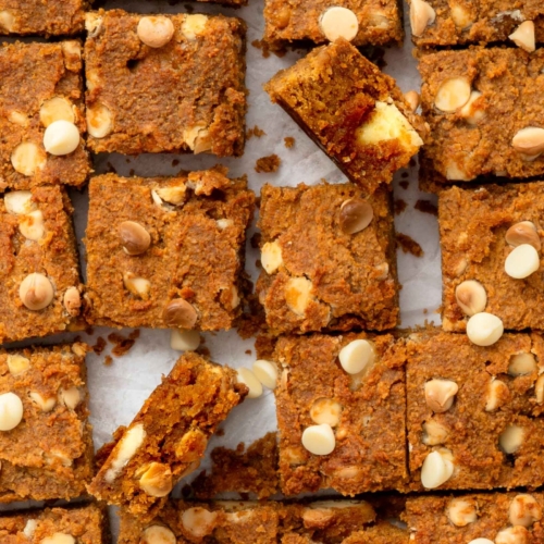 Square of vegan pumpkin chickpea blondies with white chocolate chips