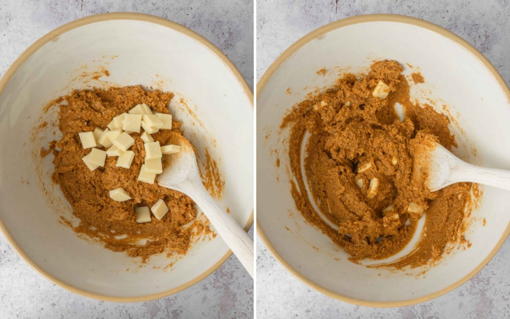White chocolate chips being mixed into a bowl of blondie batter