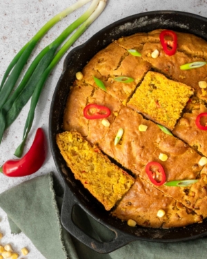 Golden Indian spiced cornbread in a cast iron pan