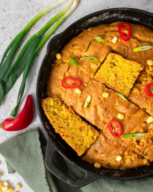 Golden Indian spiced cornbread in a cast iron pan