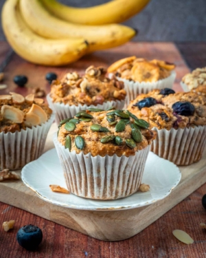 Healthy banana muffins on a wooden board