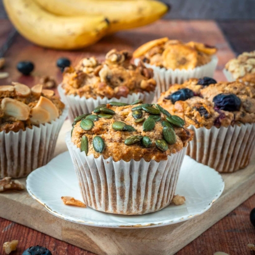 Healthy banana muffins on a wooden board