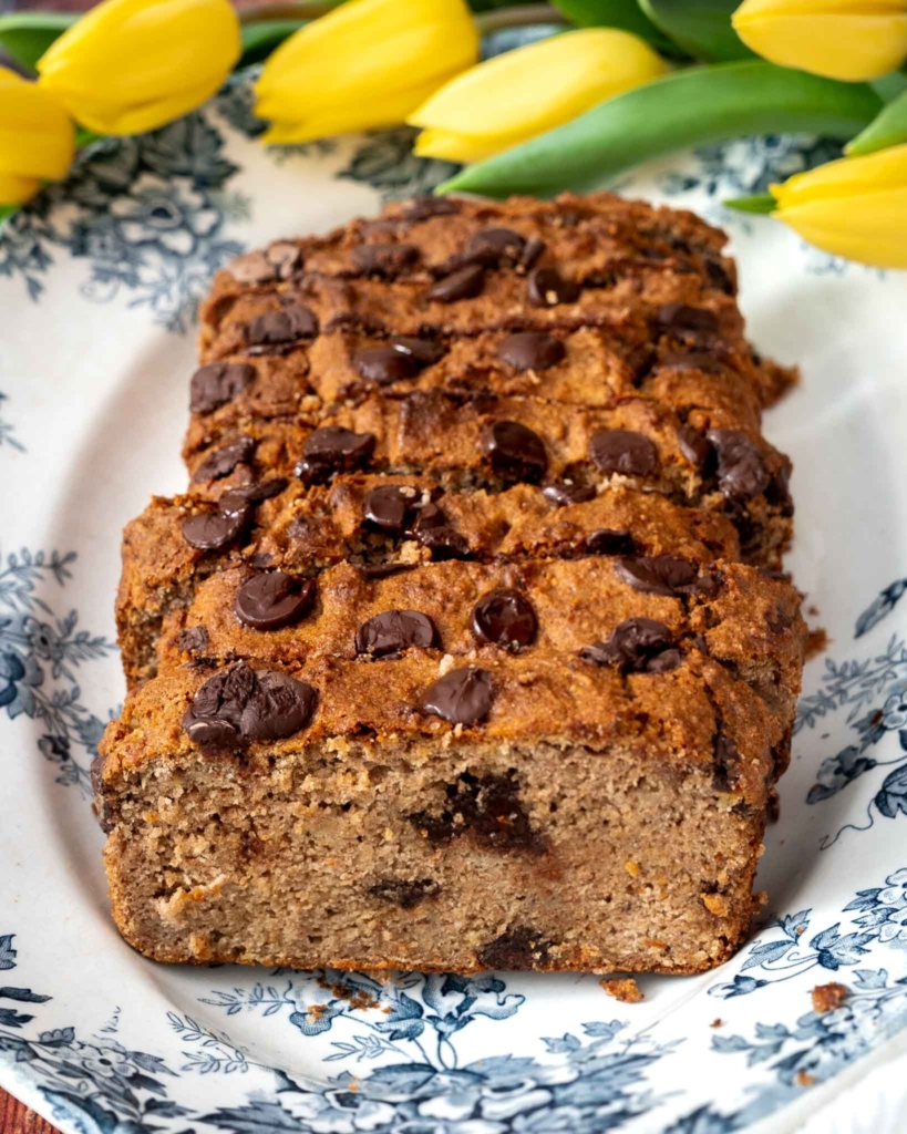 Slices of golden buckwheat banana bread on a vintage plate