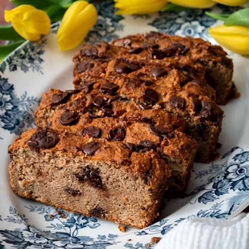Slices of golden buckwheat banana bread on a vintage plate